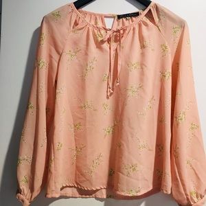 Pale pink and green floral blouse size M w cutouts